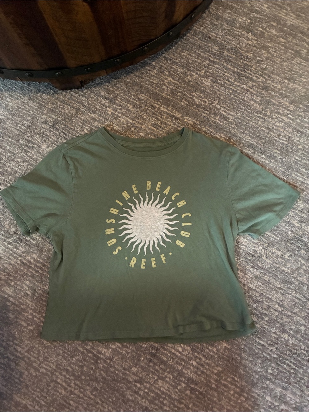 Olive green cropped tee features a retro celestial
